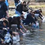 Interact Club members fill jugs and buckets in the Dungeness River for the annual Walk for Water event on March 1. They walk about 4 miles roundtrip to symbolize how far some people must go for drinking water. They raised more than $5,000 to help build a well in a Ghana village. (John Pehrson)