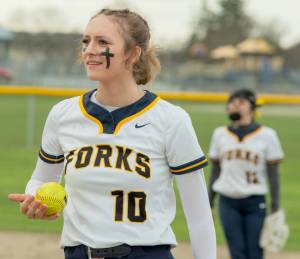 Forks' Avery Dilley prepares to pitch in a doubleheader Friday at Sequim. The Spartans won both games of the doubleheader. (Emily Mathiessen/Olympic Peninsula News Group)