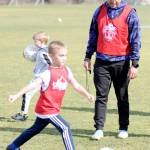 Matthew Nash/Olympic Peninsula News Group Juan Carlos Cisneros-Lopez, Sequim Junior Soccers new director of coaching, works with players, such as Barrett Gerdes, 6-and-a-half, at a preseason skills camp on March 1 at the Albert Haller Playfields. In the coming months, Cisneros-Lopez said he plans to develop a curriculum for players and coaches to succeed.
