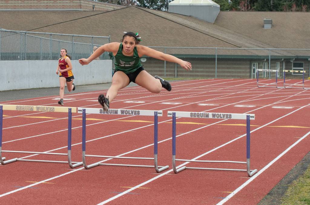 Emily Matthiessen/Olympic Peninsula News Group 
Port Angeles Shavari Epps leaps during the girls 300-meter hurdle race during a track and field meet held Thursday.