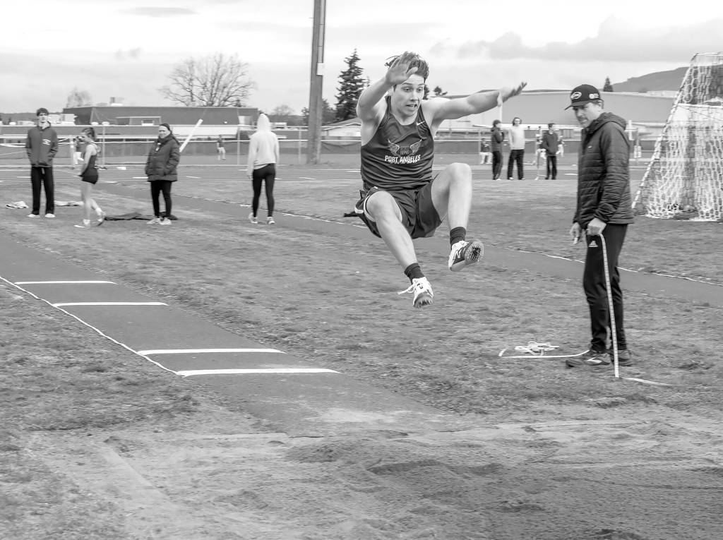 Emily Matthiessen/Olympic Peninsula News Group
Port Angeles' Richard Peterson competes in the long jump during a track and field meet held at Sequim High School on Thursday.