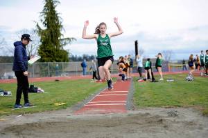 Matthew Nash/Olympic Peninsula News Group
Port Angeles freshman Madeline Walton competes in the long jump during a track and field meet held at Sequim High School. It was the first meet held on the recently resurfaced track in Sequim since 2021.