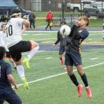 Lonnie Archibald/for Peninsula Daily News
Beaver Miquel Espinoza (10) and Spartan Abraham Montealegre (right) compete for ball control Monday evening on the turf of Spartan Stadium where Forks defeated Tenino 4-0. In on the play is Forks' Eduardo Calmo, 4, and Margarito Gonzalez Black, 11.