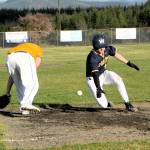 Spartan Landen Olson slides into third with a triple then scores on an overthrow.  Photo by Lonnie Archibald.