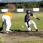 Spartan Landen Olson slides into third with a triple then scores on an overthrow. Photo by Lonnie Archibald.