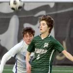 KEITH THORPE/PENINSULA DAILY NEWS
Port Angeles' Harper Willis, right, looks at a loose ball in front of North Kitsap's Gavin Alfonso on Friday at Peninsula College.