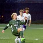 KEITH THORPE/PENINSULA DAILY NEWS Port Angeles Matthew Miller, front, gets a knee up as North Kitsaps Spencer Nelson, center, and Bryan Montes de Oca look on during Fridays match in Port Angeles.
