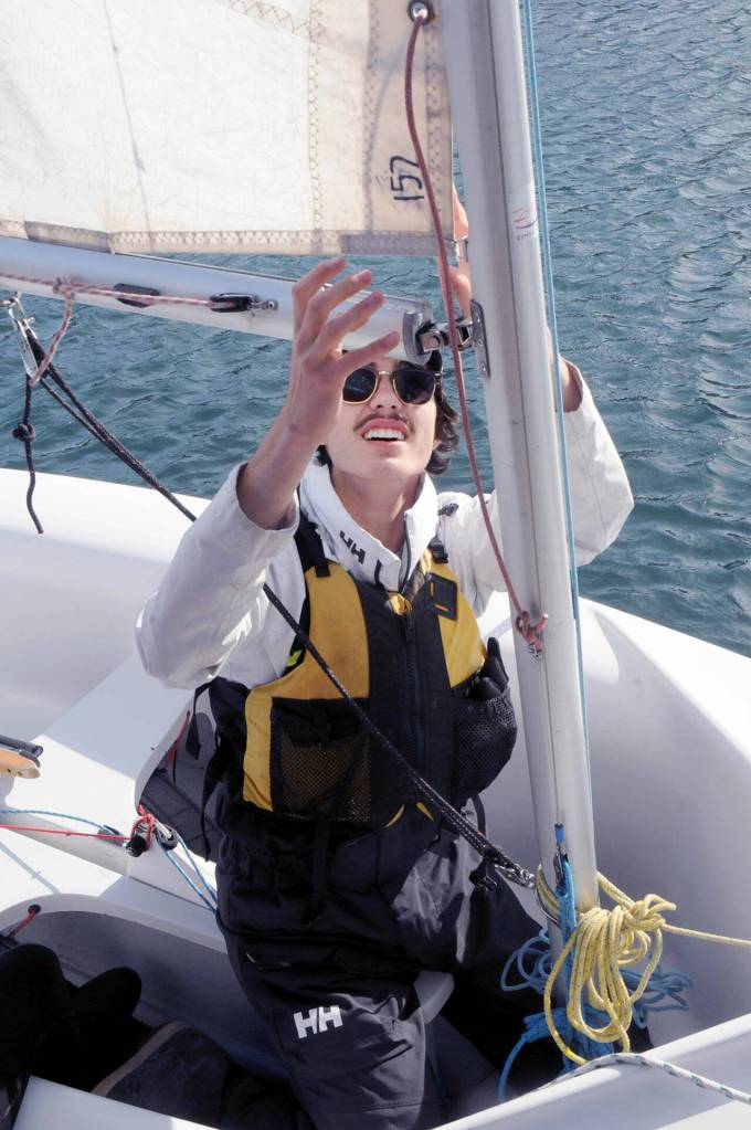 Andrew Corson checks the rigging of his boat before setting sail on Tuesday in Port Angeles. (Keith Thorpe/Peninsula Daily News)