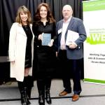 Clallam County Economic Development Council Director of Operations Lorie Fazio, left, and Executive Director Colleen McAleer stand with Michael Cade, executive director of Thurston EDC who presented the WEDAs 2025 Innovation in Economic Development award. The EDC received the award last month in recognition of its Clallam Forest Product Innovation Program.