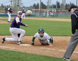 Dave Logan/for Peninsula Daily News
An errant pickoff attempt skipped past Sequim first baseman Braydon White and Port Angeles baserunner Alex Angevine. Angevine advanced to third base on the play, scoring on another throwing error.