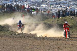 Roger Harnack/Cheney Free Press
Clayton Ernst of Port Angeles, right, rides through the holeshot leading to the Desert 100 motorcycle races first turn last Sunday near Odessa. Ernst went on to win the 386-participant overall 50-mile race along with his 15-and-younger age division on his KTM.