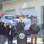 East Jefferson Fire Rescue Chief Bret Black addresses a group of attendees at the Port Ludlow fire department on Wednesday. From left to right are Smokey Bear, Jefferson County Commissioner Heidi Eisenhour, Black, Jesse Duvall, the state Department of National Resources Community Resilience coordinator, and EJFR Community Risk Manager Robert Wittenberg. (Elijah Sussman/Peninsula Daily News)
