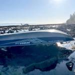 A 15-foot pleasure craft sits capsized at Koitlah Point on Thursday. U.S Coast Guard, local and federal agencies responded to a report of an overdue vessel with three people on board after they failed to return Wednesday evening. (U.S. Coast Guard)