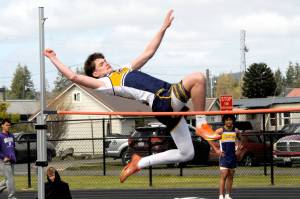 Forks' Gage Willenbrink leaps in the high jump at the Forks Lions Club Track and Field Invite on Saturday. Willenbrink finished third in the high jump with a height of 5 feet, 6 inches. (Lonnie Archibald/for Peninsula Daily News)