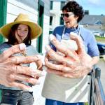 Eponine Bertucci-Kenyon, left, and teaching artist Michele Soderstrom show off the hands they painted for Bertucci-Kenyons piece in the Student Wearable Art Show. The show has two performances Saturday afternoon at the Port Townsend High School auditorium. (Diane Urbani de la Paz/for Peninsula Daily News)