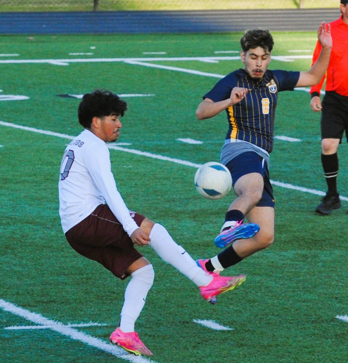 Lonnie Archibald/for Peninsula Daily News 
Forks DeAnthony Davila, right, leaps to deflect the ball away from Montesanos Cristofer Tobar during the Spartans penalty kick shootout win at Spartan Stadium on Wednesday.