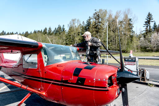 Fred Lundahl, a pilot from Whidbey Island, prepares to fuel up his 1968 Cessna Aerobat, named Scarlett, at the Jefferson County International Airport in Port Townsend. Lundahl was picking up his plane Wednesday from Tailspin Tommys Aircraft Repair facility located at the airport. (Steve Mullensky/for Peninsula Daily News)