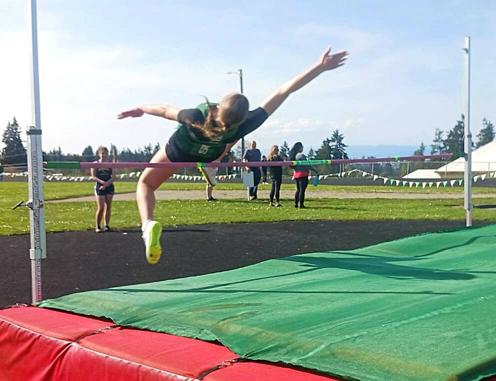 Port Angeles Brooke Pierce clears the bar in the high jump in Thursdays track meet at Port Angeles High School. Pierce won the high jump with a leap of 4 feet, 8 inches. (Pierre LaBossiere/Peninsula Daily News)