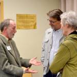 Josh Peters, left, in conversation with two attendees at Tuesday nights event in the Humphrey room at Jefferson County Library District. (Elijah Sussman/Peninsula Daily News)