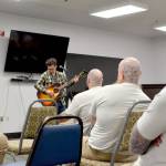 Matt Butler performs for about 70 incarcerated people in the visiting room at Clallam Bay Corrections Center on Thursday afternoon. (Elijah Sussman/Peninsula Daily News)