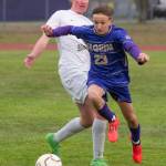 Sequims Colten Anderson (23) battles for a loose ball with Port Angeles Jake Weaver on Friday night in Sequim. The Wolves won 1-0. (Emily Mathiessen/Olympic Peninsula News Group)