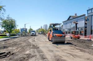 A road roller from Northern Asphalt compacts the dirt on Tyler Street in Uptown Port Townsend. The asphalt work may be finished by today to allow for striping so the street will be open in time for Saturdays Farmers Market. (Steve Mullensky/for Peninsula Daily News)