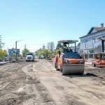 A road roller from Northern Asphalt compacts the dirt on Tyler Street in Uptown Port Townsend on Monday. The asphalt work may be finished by Wednesday to allow for striping so the street will be open in time for Saturdays Farmers Market. (Steve Mullensky/for Peninsula Daily News)