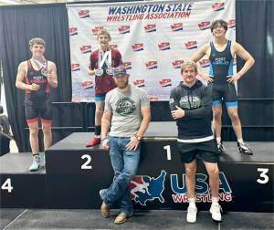 Members of the Port Angeles Wrestling Club competed in the USA Wrestling Freestyle/Greco-Roman state tournament in Spokane this weekend. From left, are Jace Collins, Carson Grooms and Crew Disher. Coaches are, from left, Rob Grooms and Dom Timpero. (Courtesy of Rob Gale)