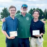 From left, Port Angeles Austin Worthington, coach Bob Anderson and Cale Wentz celebrate Worthington and Wentz winning the Duke Streeter Invitational at Peninsula Golf Club on Tuesday. (Courtesy of Bob Anderson)
