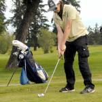 KEITH THORPE/PENINSULA DAILY NEWS Cody Dunscomb of Sequim addresses the ball in the Duke Streeter Invitational on Friday at Peninula Golf Club in Port Angeles.
