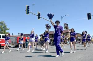 Sequim High Schools cheerleaders wave to the crowd at last years Sequim Irrigation Festival Grand Parade. Organizers said at least 110 entries will return for Saturdays event, which is set to begin at noon. (Michael Dashiell/Olympic Peninsula News Group file)