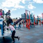 Chimacum Elementary School sixth-grade students jump on a rotating maypole as they use the new playground equipment on Monday during recess. The playground was redesigned with safer equipment and was in use for the first time since inspections were completed last Thursday. (Steve Mullensky/for Peninsula Daily News)