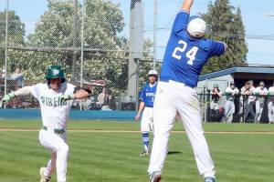 Port Angeles Ian Smithson reaches first baseball safely as the throw to the Eatonville first baseman was high and pulled him off the bag. Port Angeles won 8-1 to stay alive in the District 3 tournament. (Dave Logan/for Peninsula Daily News)