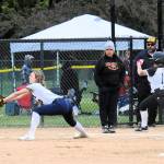 Forks Avery Diley takes the throw at first for the out against Rainier runner Mia Naval on Wednesday afternoon at Borst Park in Centralia during the District 4 tournament. The Spartans fell to the Mountaineers 8-7 to close out the season. (Lonnie Archibald/for Peninsula Daily News)