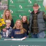 Port Angeles Ava-Anne Sheahan signed to play soccer for Corban University in Salem, Ore., last week surrounded by her family, from left, mother Megan Shean, brother Axel Johnston, sister Addy Johnston and father Bucky Johnston. (Pierre LaBossiere/Peninsula Daily News)