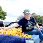 Port Angeles Mayor Kate Dexter is one of several local people who helped pluck a winning duck from a pickup truck on Sunday at Port Angeles City Pier. There was 36 ducks to be plucked from six Wilder Toyotas. (Dave Logan/For Peninsula Daily News)