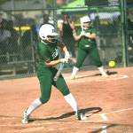 Port Angeles Kennedy Rognlien swings at a pitch Friday in Selah against Woodland as teammate Abby Kimball waits in the on-deck circle. (Dan Rosenfield/Longview Daily News)