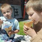 Edmond Mills, 4, and his brother, Avery Mills, 10, both of Port Angeles, enjoy ice cream on Saturday at the Juan de Fuca Festival. (Keith Thorpe/Peninsula Daily News)