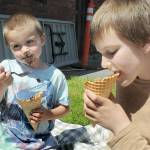 Edmond Mills, 4, and his brother, Avery Mills, 10, both of Port Angeles, enjoy ice cream on Saturday at the Juan de Fuca Festival. (Keith Thorpe/Peninsula Daily News)
