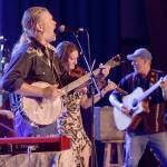 Poor Mans Whiskey, from left, bassist Mark Murphy, band leader Josh Brough, guest fiddler Chandra Johnson and co-founder Jason Beard command the Main Stage at the Juan de Fuca Festival on Saturday. (Keith Thorpe/Peninsula Daily News)