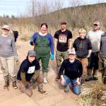 Northwest Watershed Institutes field restoration crew, from left to right, are Megan Brookens, Grace Burke, Hanna Petersen, Bernt Goodson, Eva Ellis, Veronica Phelan, Zach Hawkes and Wesley Meyers. They worked at a restoration site at the Tarboo Wildlife Preserve. (Northwest Watershed Institute)