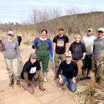 Northwest Watershed Institutes field restoration crew, from left to right, are Megan Brookens, Grace Burke, Hanna Petersen, Bernt Goodson, Eva Ellis, Veronica Phelan, Zach Hawkes and Wesley Meyers. They worked at a restoration site at the Tarboo Wildlife Preserve. (Northwest Watershed Institute)