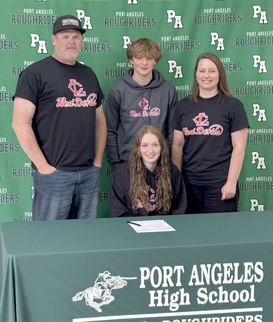 Port Angeles Zoe Ernst signs to play soccer for Lower Columbia College surrounded by her, from left, father Jaxon Ernst, brother Clayton Ernst and mother Emily Ernst. (Port Angeles High School)