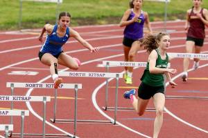 Port Angeles' Faerin Tait, front, runs in the hurdles during the Olympic League Championships at North Mason High School. Tait will compete in four events at the Class 2A State Track & Field Championship this weekend.