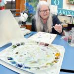 KEITH THORPE/PENINSULA DAILY NEWS
Barbara Westrem of Sequim paints her impressions of microscopic marine creatures during an adult drawing class on Wednesday at Feiro Marine Life Center in Port Angeles. The class, “Through the Looking Glass!,” gives participants a chance to work with professional artists to create works based upon what they observe. More information can be found at https://feiromarinelifecenter.org/through-the-looking-glass-adult-drawing-class-with-microscopes/.