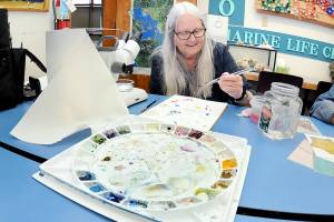 KEITH THORPE/PENINSULA DAILY NEWS
Barbara Westrem of Sequim paints her impressions of microscopic marine creatures during an adult drawing class on Wednesday at Feiro Marine Life Center in Port Angeles. The class, “Through the Looking Glass!,” gives participants a chance to work with professional artists to create works based upon what they observe. More information can be found at https://feiromarinelifecenter.org/through-the-looking-glass-adult-drawing-class-with-microscopes/.