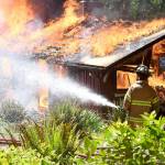 A 1949 built cabin at Lake Gibbs in Chimacum, was used for a live structure fire training by East Jefferson Fire Rescue Wednesday. (East Jefferson Fire Rescue)