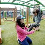 Elizabeth Angell of Port Angeles keeps watch on her son, Myles Angell, 2, during an outing at the Dream Playground at Erickson Playfield on Wednesday in Port Angeles. Portions of the playground are currently closed for maintenance and the entire playground is scheduled to be closed on Saturday morning for seasonal play surface rehabilitation. (Keith Thorpe/Peninsula Daily News)