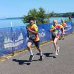 Two young runners in the kids marathon sprint to the finish Saturday afternoon at the Port Angeles City Pier. (Pierre LaBossiere/Peninsula Daily News)