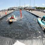 Ethan Davidson, 16, left, competes with his brother, Pierce Davidson, 12, both of Dallas, Texas, in a paddleboard race on a temporary course set up at East Boat Haven in Port Angeles as part of the weekends Maritime Career Fair & Festival. The two-day event, hosted by the Port of Port Angeles, featured informational displays, childrens activities, maritime demonstrations, food, music and a fishing derby. (Keith Thorpe/Peninsula Daily News)